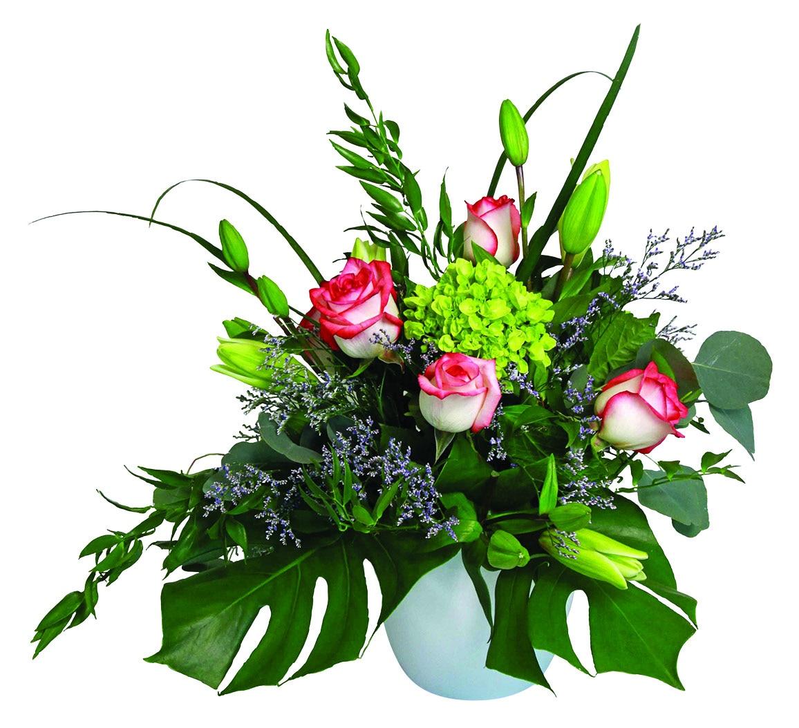 A fresh arrangement with red and white roses, green hydrangea, white lilies, greens and fillers.