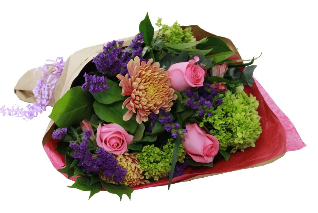 A gift-wrapped bouquet with pink roses, orange chrysanthemums, purple buds and greens.