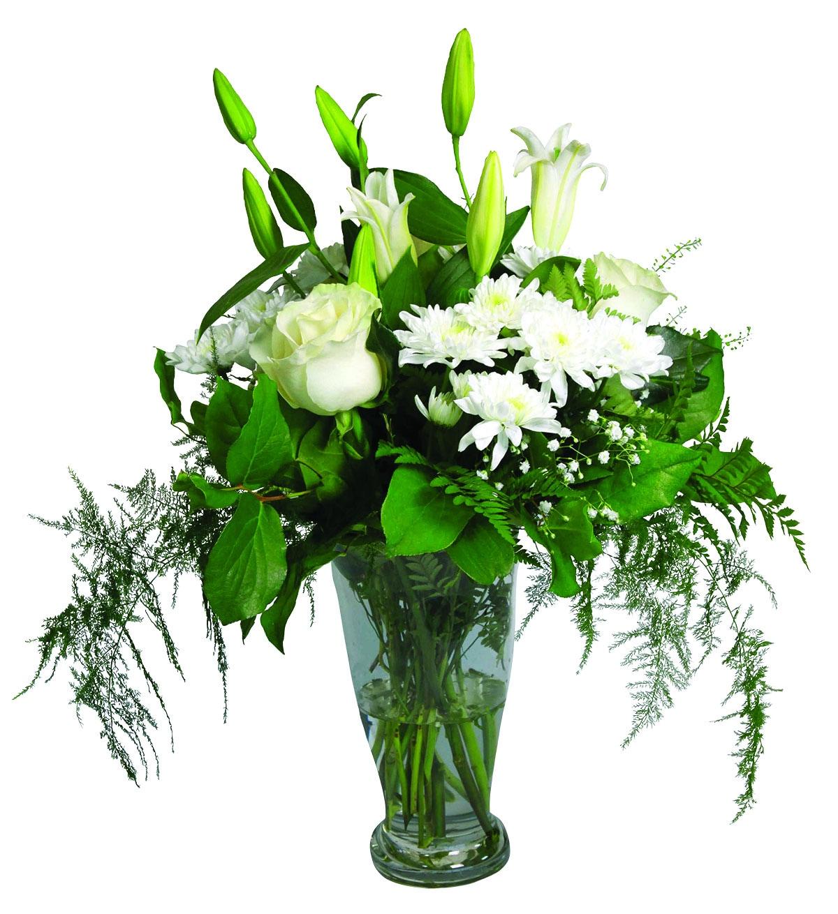 A tall vase arrangement with white roses, lilies, chrysanthemums and greens.