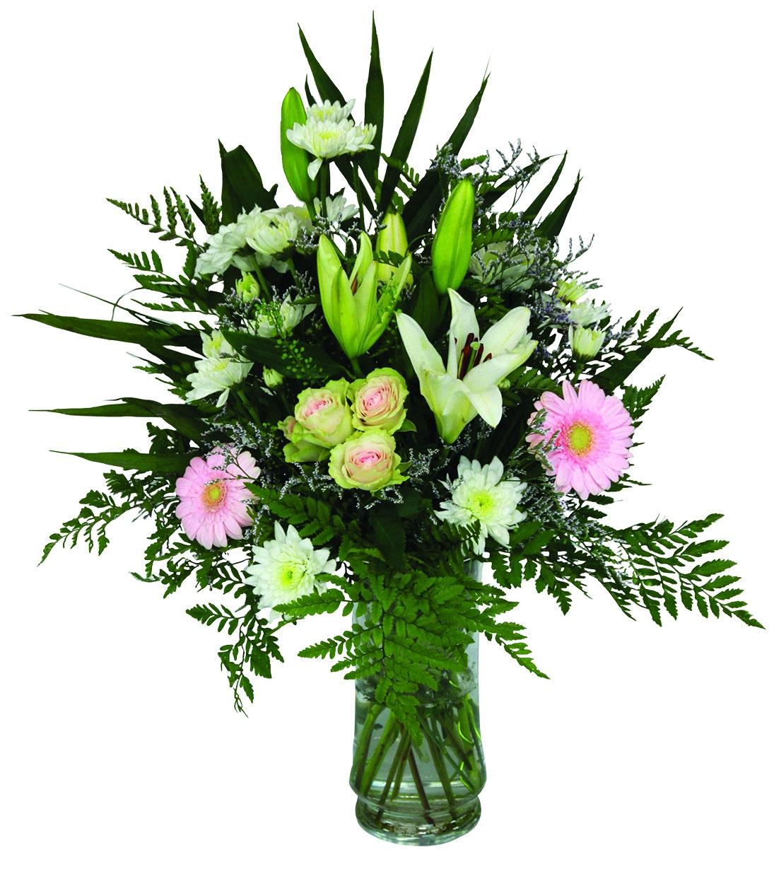 A one sided vase arrangement with white lilies, roses, mums, pink gerberas, greens and fillers.