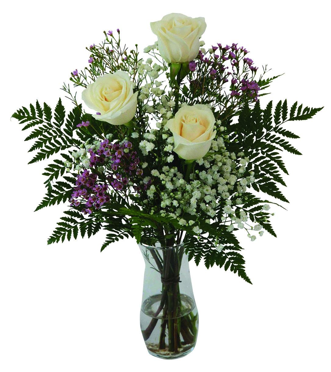 A vase arrangement with 3 white roses, greens and fillers.