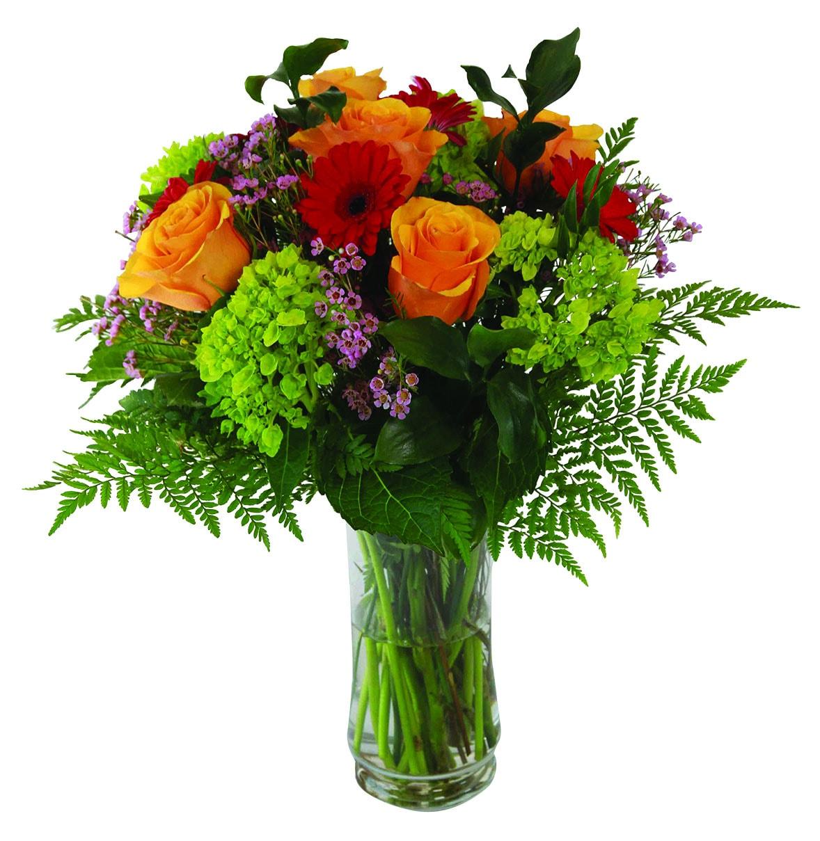 A vase arrangement with orange roses, white hydrangea, red mini gerberas, greens and fillers.